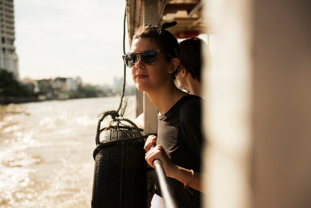 Premium Photo | A caucasian woman enjoying the boat ride