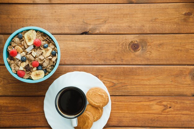 Free Photo | Cereal and coffee cup with cookies