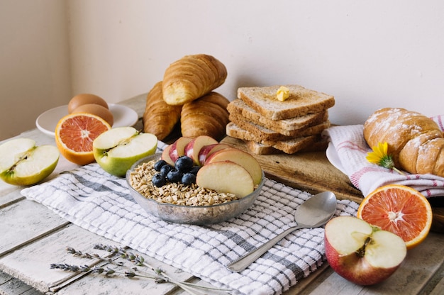 Free Photo | Cereal, toasts and fruits on table