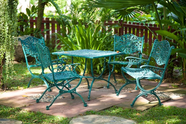 Premium Photo | Chairs and tables, located in the garden.