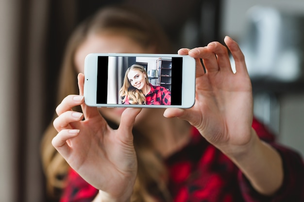 Premium Photo | Charming cheerful young woman in plaid shirt taking