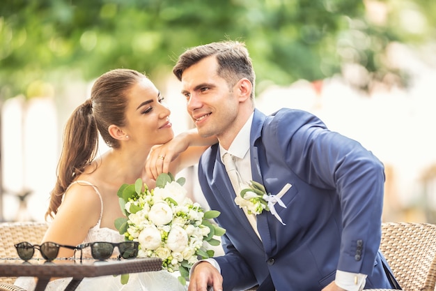 premium-photo-charming-couple-sitting-in-town-after-a-wedding