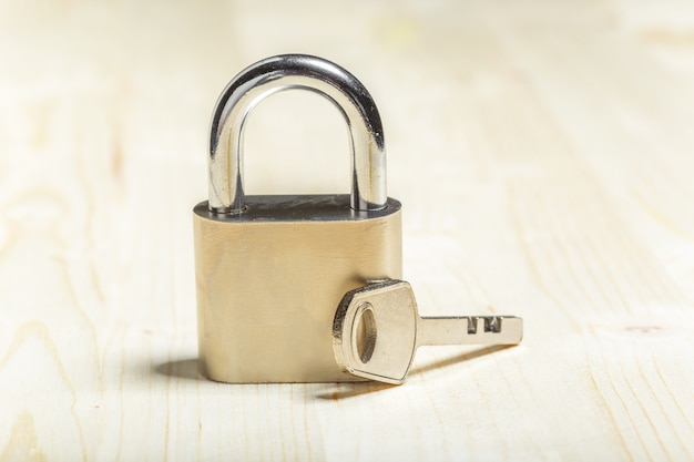 Check-lock on the wooden table Photo | Premium Download