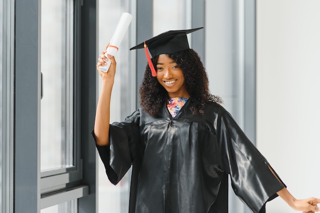 Premium Photo | Cheerful african american graduate student with diploma ...