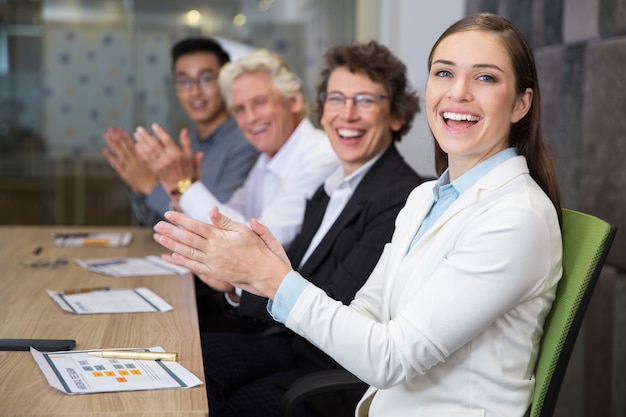 cheerful-business-people-clapping-in-boa