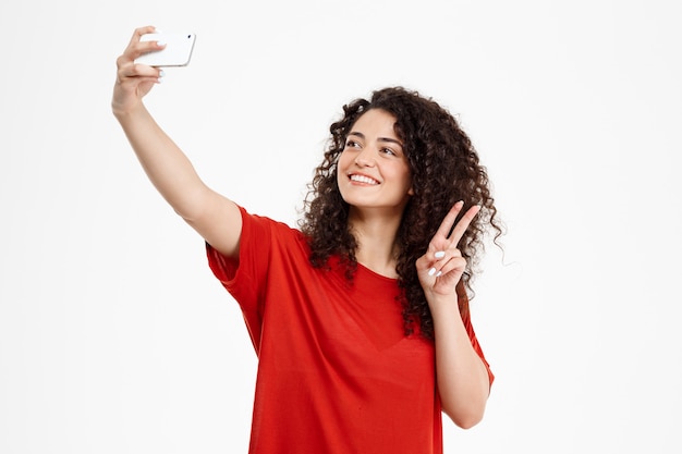 Free Photo Cheerful Curly Girl Make Selfie