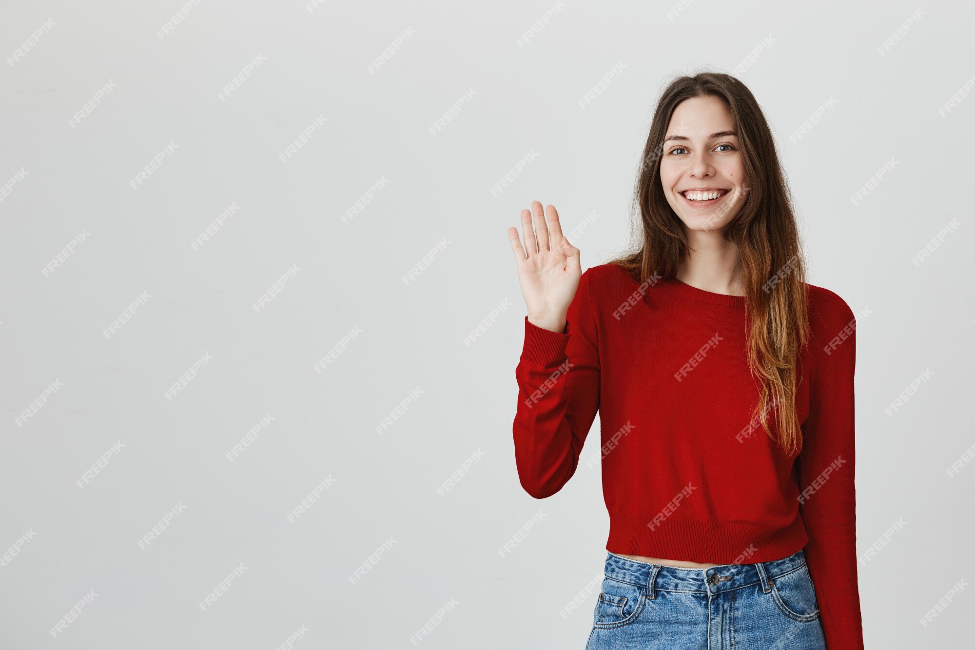 Free Photo Cheerful Friendly Attractive Woman Waving Hand Saying Hello