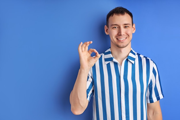 Premium Photo Cheerful Man Showing Ok Gesture And Smile Feel Happy