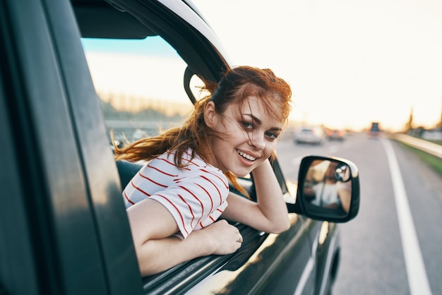Premium Photo | Cheerful woman in car trip journey road