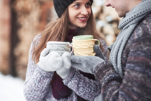 Cheerful young couple having fun in winter park Premium Photo
