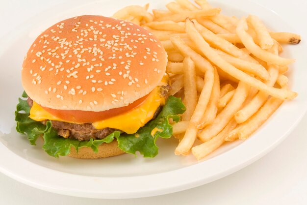 Premium Photo Cheeseburger With French Fries On Plate Close Up