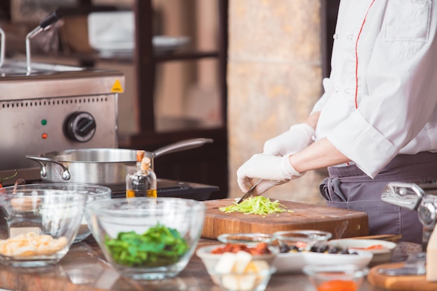 Premium Photo | Chef cooks spaghetti in a premium restaurant.