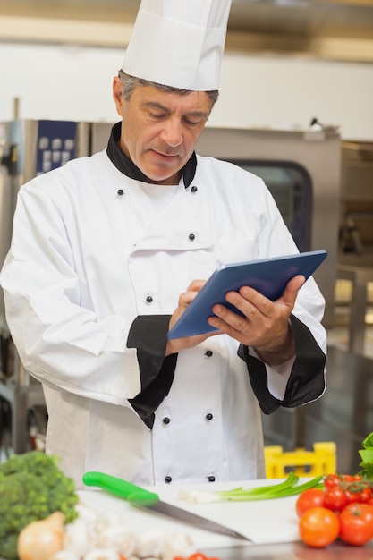 Premium Photo | Chef using digital tablet