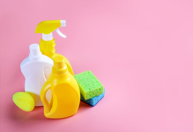 Premium Photo | Chemical cleaning supplies on pink background