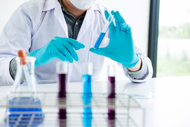 premium-photo-chemist-is-analyzing-sample-in-laboratory-with-equipment