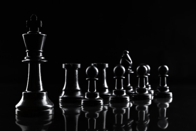 Premium Photo | Chess figures on dark black background close up