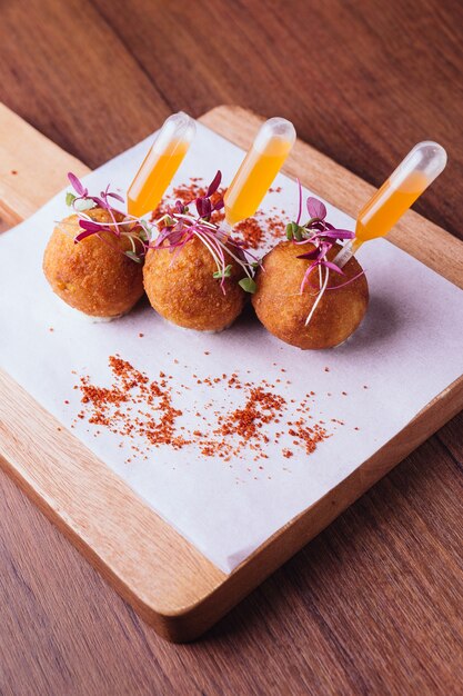 Premium Photo | Chicken biryani arancini served in rice ball.