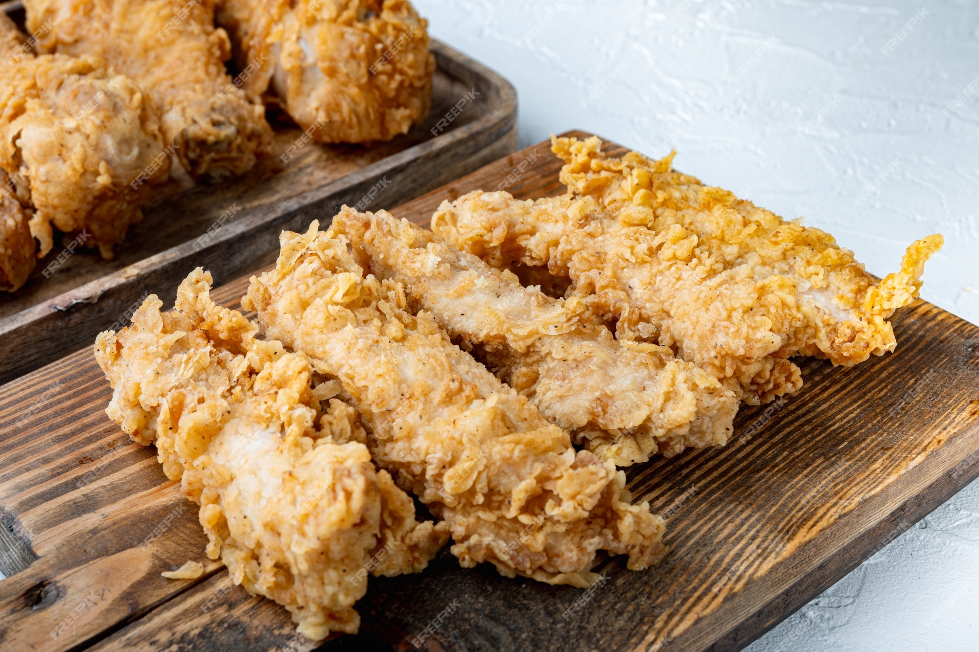 Premium Photo | Chicken breaded fillet stripes on white background