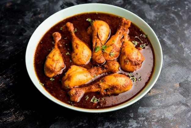 Premium Photo | Chicken curry with legs or drumstick or murg tangri or ...