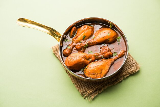 Premium Photo | Chicken curry with legs or drumstick or murg tangri or ...