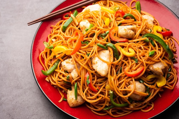 Premium Photo | Chicken hakka noodles or schezwan or szechwan noodles ...