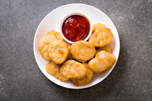 Premium Photo | Chicken nuggets with sauce