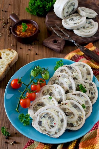 Premium Photo | Chicken roll (roulade) with omelet (omelette) and mushrooms