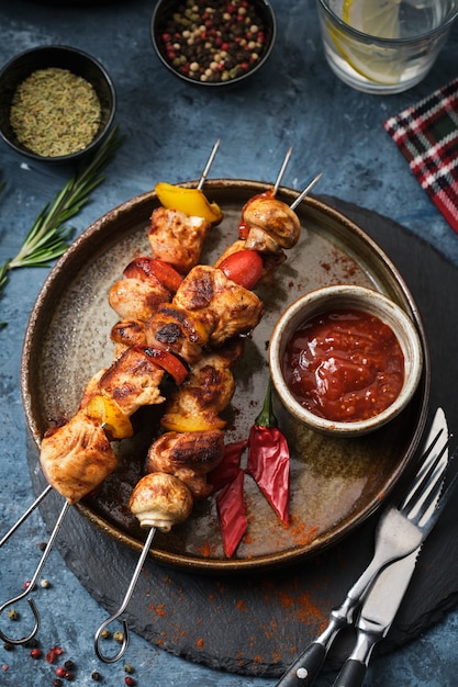 Premium Photo | Chicken shish kebab with mushrooms, cherry tomato and ...