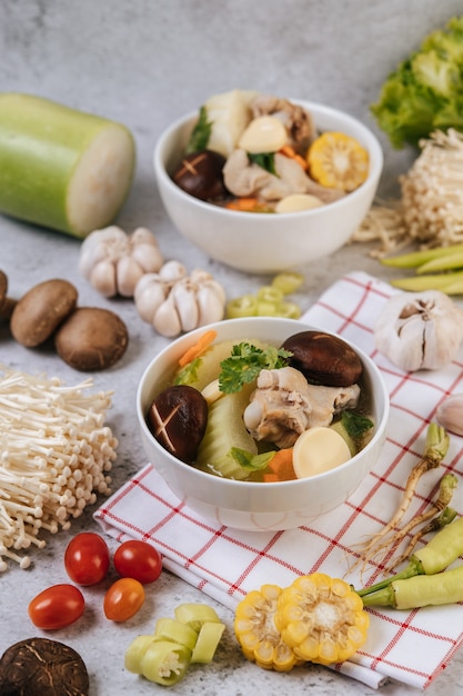 Free Photo | Chicken soup with corn, shiitake mushroom, enoki mushroom ...