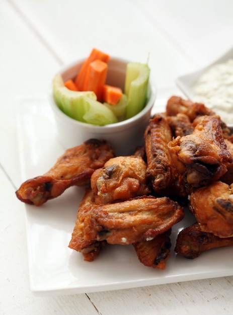 Free Photo | Chicken wings with sauce and vegetables