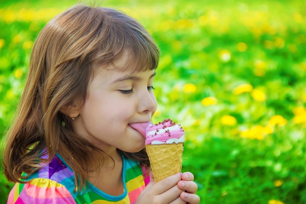 Premium Photo The Child Eats Ice Cream Selective Focus