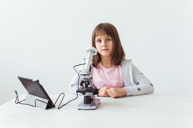 Premium Photo Child Girl In Science Class Using Digital Microscope Technologies Children And Learning Concept