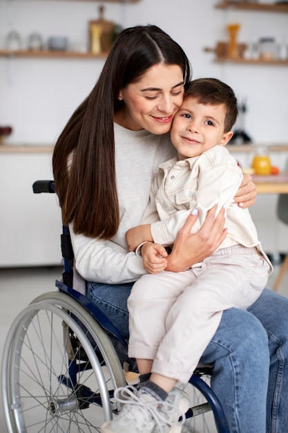 Free Photo | Child helping his disabled mother