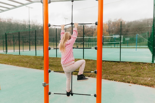 Premium Photo | The child is engaged in training on the sports ground ...