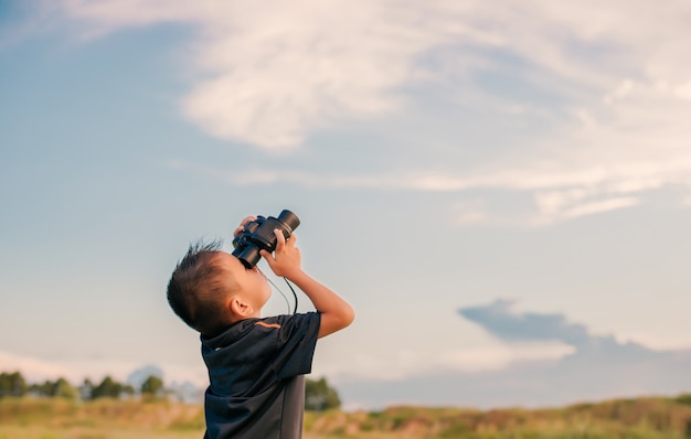 Child With Binoculars Looking At The Sky Photo Free Download