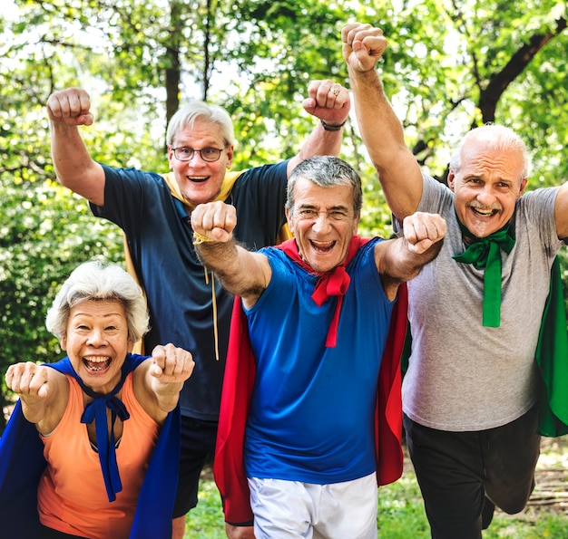 Childlike seniors wearing superhero costumes Premium Photo
