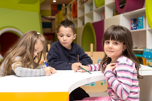 Premium Photo | Children drawing at playroom