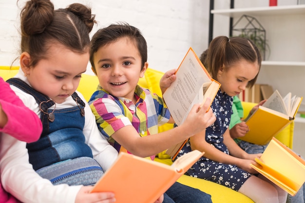 Children group reading books | Free Photo