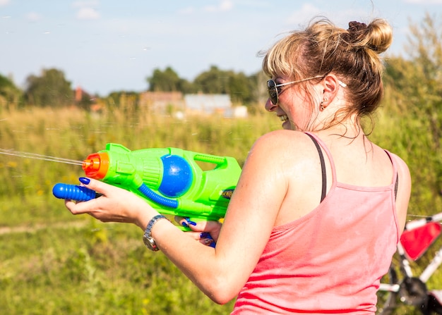 Premium Photo | Children playing water battle water game battle