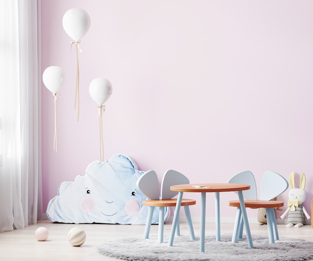 ピンクの壁とキッズテーブルのある子供用プレイルーム ぬいぐるみと風船のある子供部屋のインテリア プレミアム写真