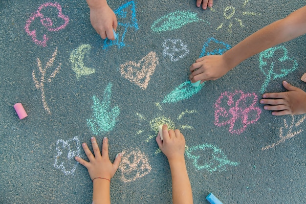 Premium Photo | Children's drawings on the asphalt with chalk.