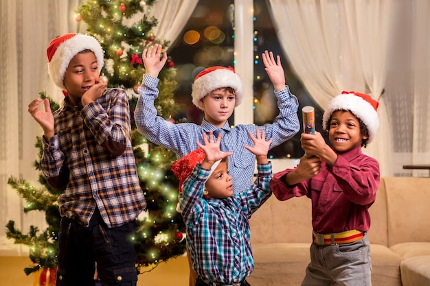 Premium Photo | Children scared of christmas petard. boy scared friends ...