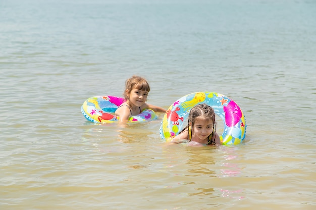 Premium Photo Children Swimming In The Lake