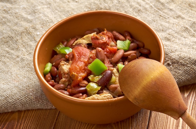 Premium Photo | Chili con carne spicy stew containing chili peppers meat