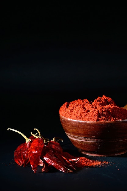 Premium Photo | Chilly powder in wooden bowl with red chilly, dried ...