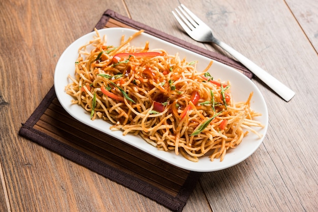 Premium Photo | Chinese bhel is a spicy indo-chinese recipe, served in ...