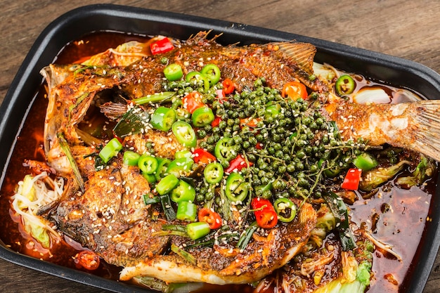 Premium Photo | Chinese cuisine: a plate of spicy roast fish