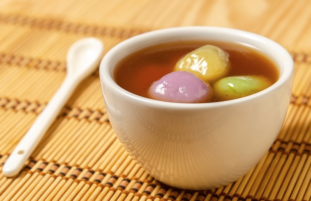 Premium Photo | Chinese dessert glutinous rice balls with black sesame past (tang yuan)