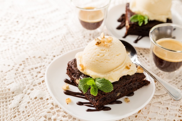 Premium Photo Chocolate Brownie With Vanilla Ice Cream Nuts And Mint