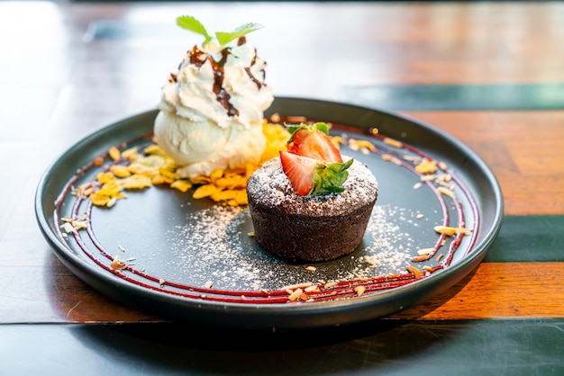 Premium Photo | Chocolate cake lava with strawberry and vanilla ice